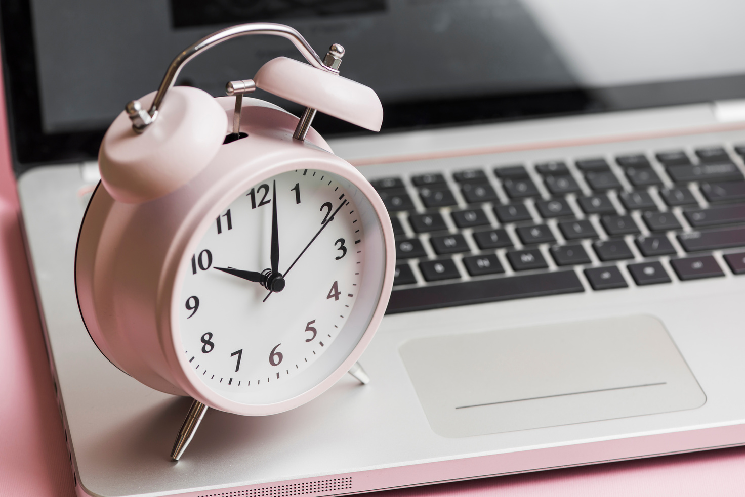 Pink Vintage Alarm Clock Open Laptop
